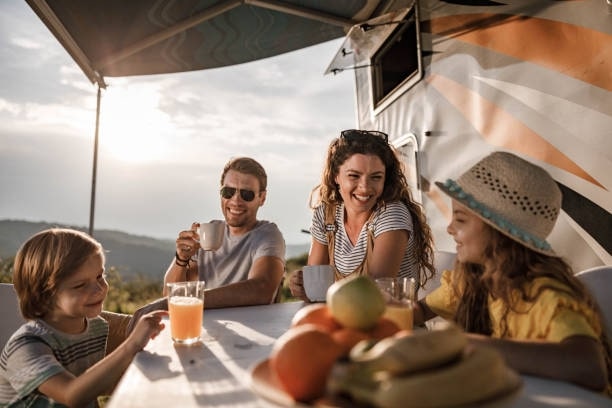 Family on a camping trip in a campervan