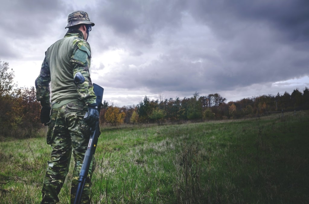 Person carrying a rifle
