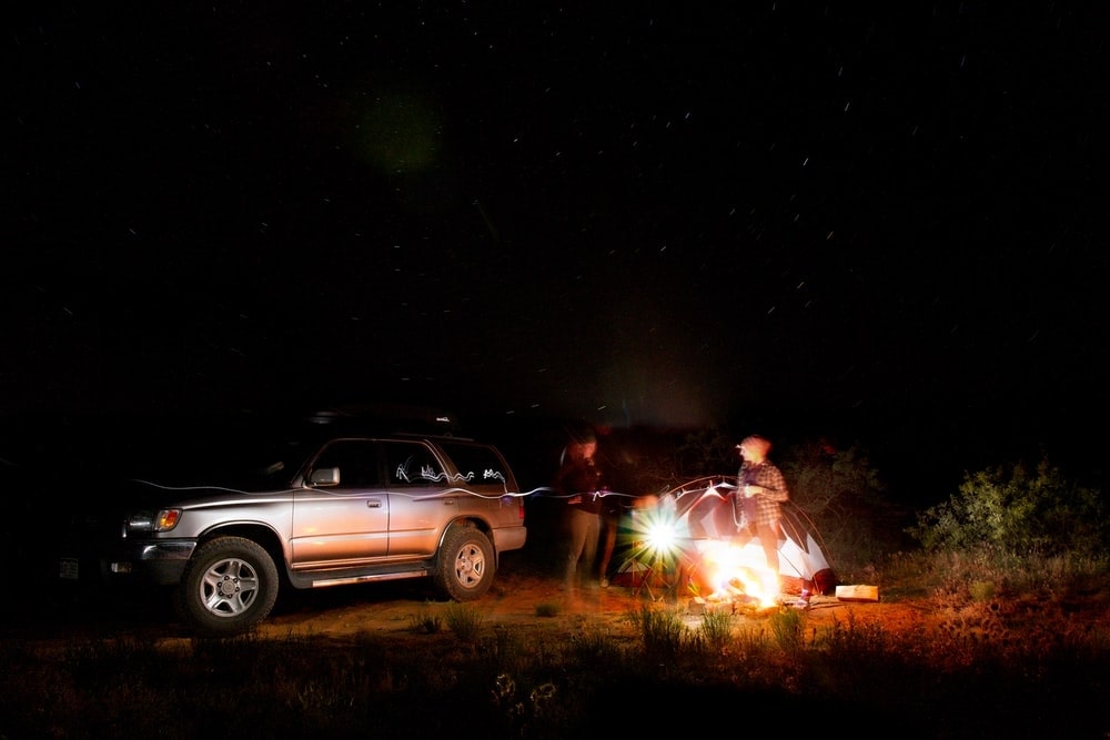 people standing outside their camp