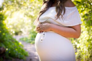 a pregnant lady standing