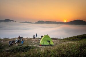 two people camping in a tent